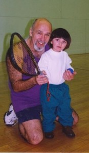 Sergio (picture on right teach a little boy racquetball) with his wife, Randi Rubin Roriguez held racquetball tournaments for over five years to raise some of the funds that significantly contributed to ‘r kids building to become a reality.